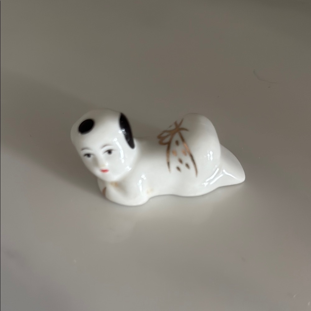 White Ceramic Chopstick Figurine with Black and Gold Accents TAO